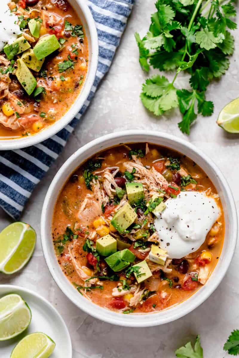 Slow cooker chicken enchilada soup is full of flavor and the perfect weeknight meal that takes no time at all to put together!