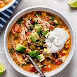 Slow cooker chicken enchilada soup is full of flavor and the perfect weeknight meal that takes no time at all to put together!