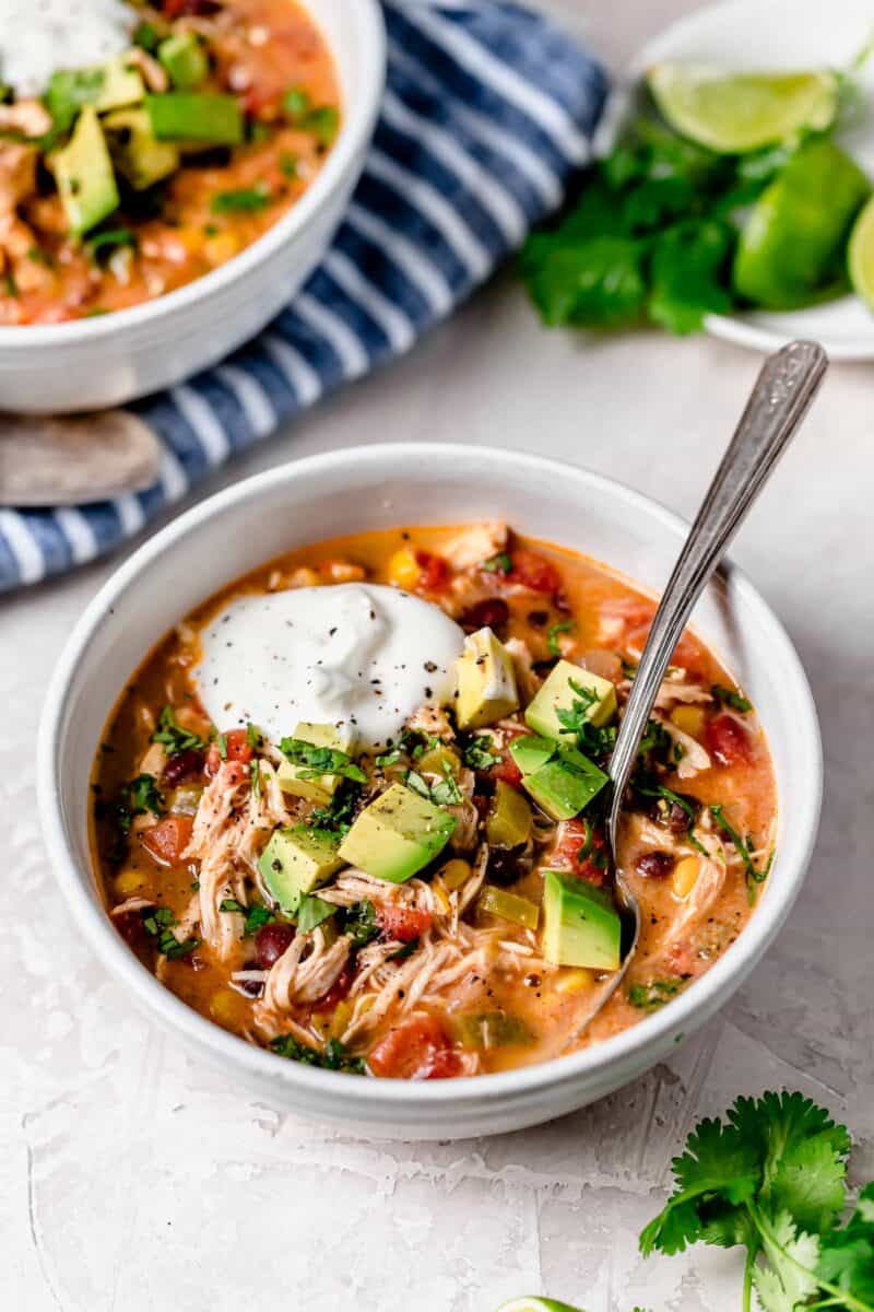 Slow cooker chicken enchilada soup is full of flavor and the perfect weeknight meal that takes no time at all to put together!