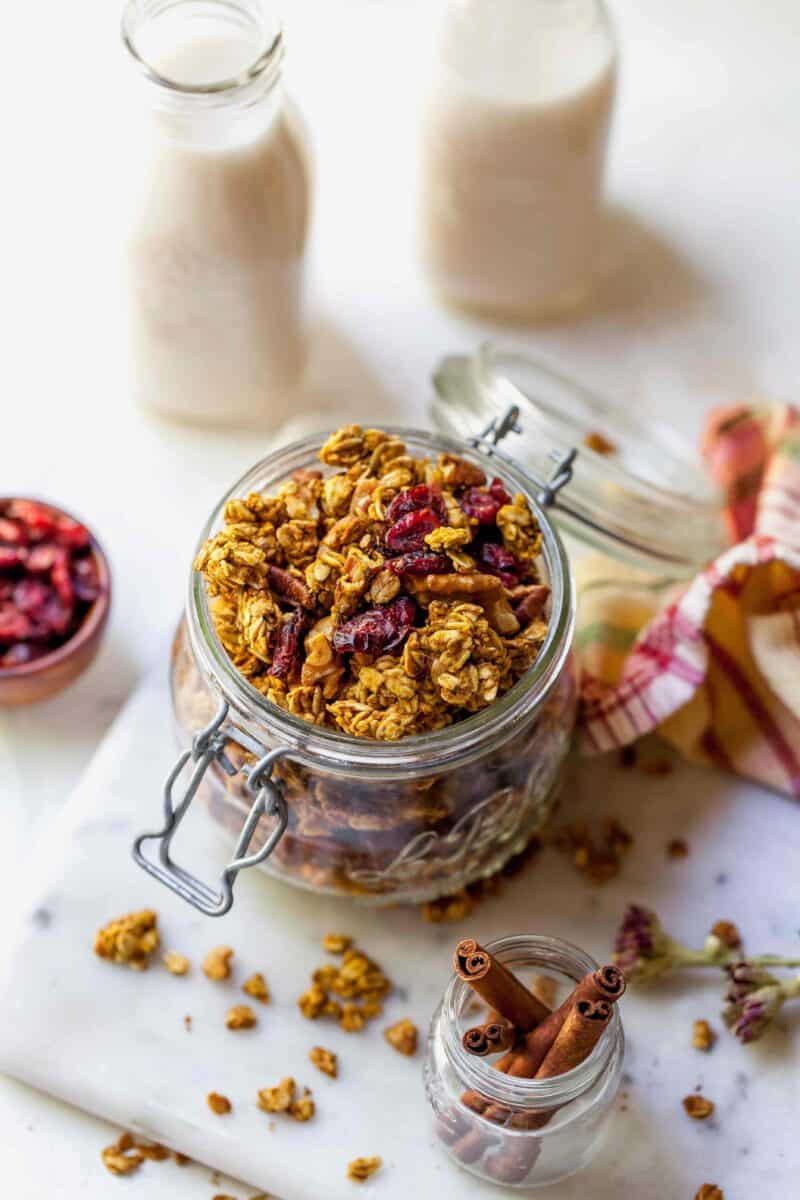 Pumpkin cranberry granola is a deliciously simple yet aromatic Fall treat! You'll want to eat it with almost everything!