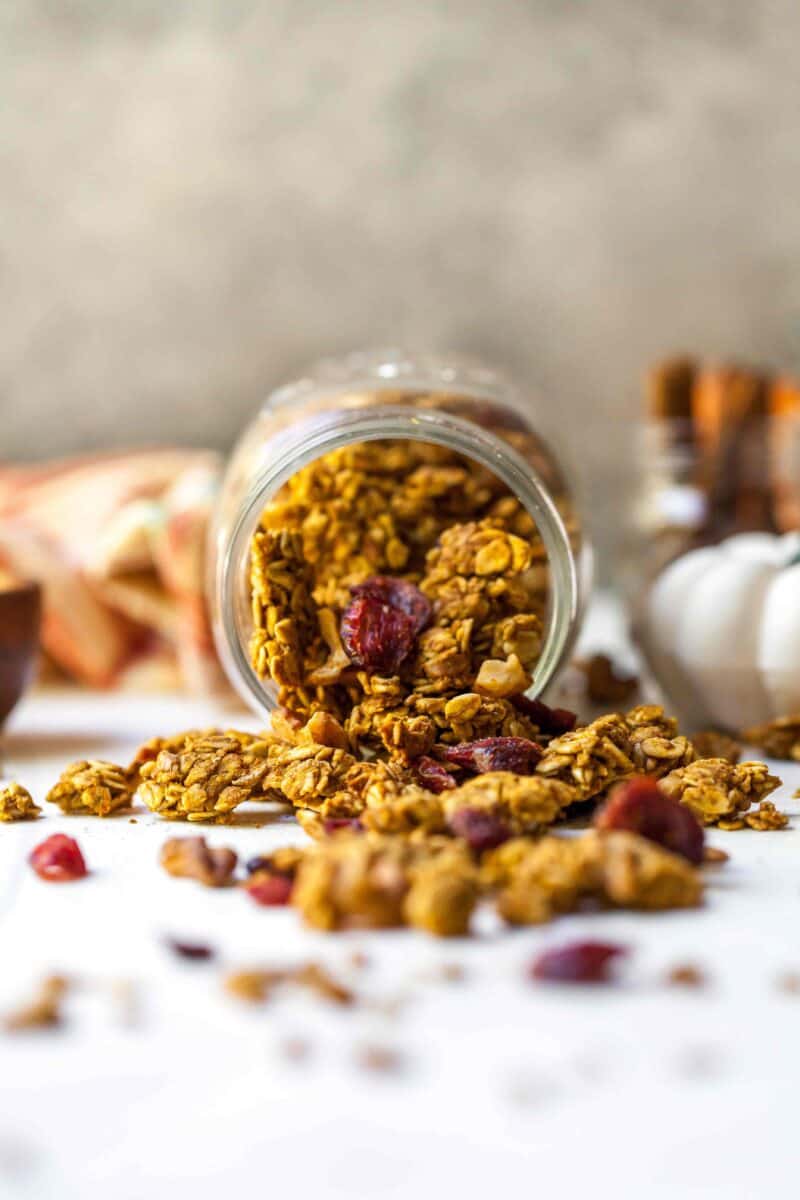 Pumpkin cranberry granola is a deliciously simple yet aromatic Fall treat! You'll want to eat it with almost everything!