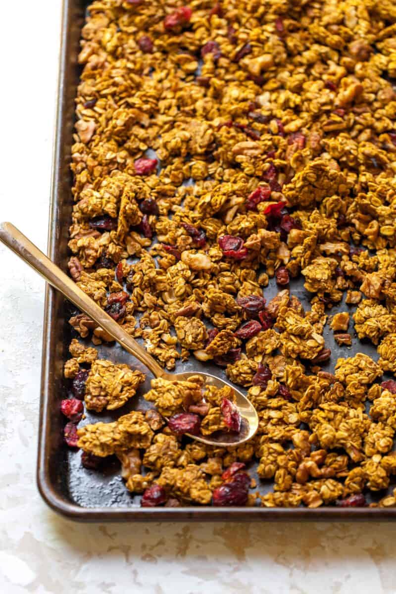 Pumpkin cranberry granola is a deliciously simple yet aromatic Fall treat! You'll want to eat it with almost everything!