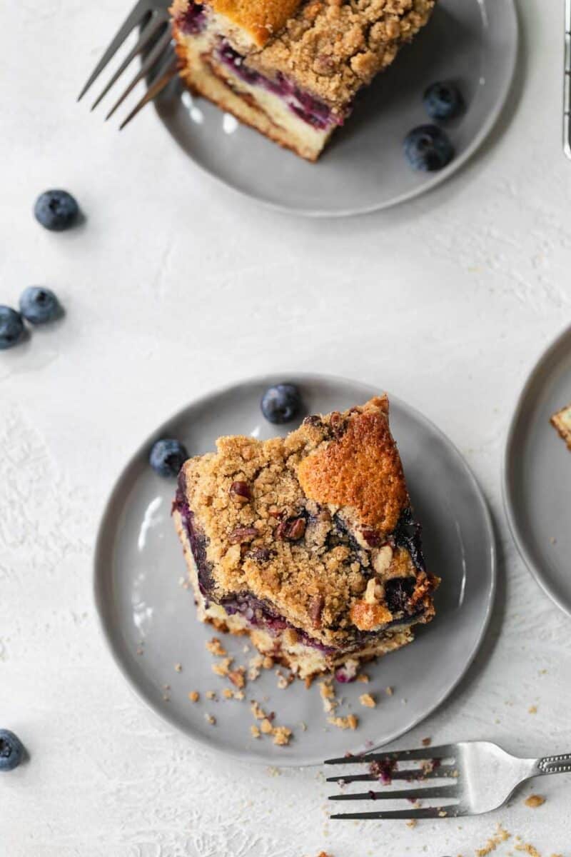This blueberry coffee cake is tender, moist, and bursting with fresh summer blueberries! The perfect pairing with your coffee or afternoon tea!
