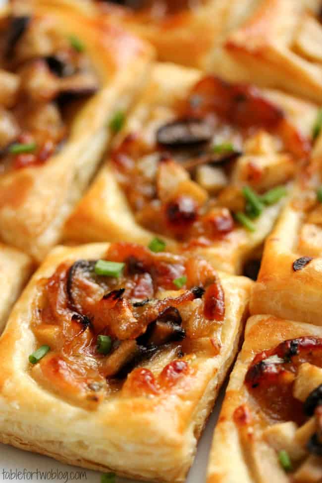 Closeup shot of Caramelized Onion, Mushroom, Apple, and Gruyere Puff Pastry Appetizers