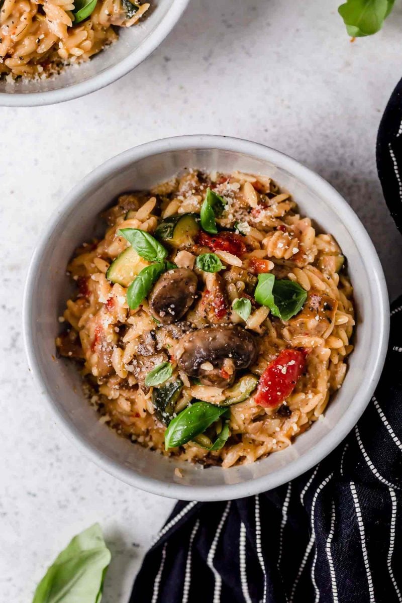 This one-pot creamy orzo with chicken sausage is a delightful dish that can be thrown together even on the busiest of weeknights! Use whatever you have in the fridge and you're sure to have a delicious meal at the end!