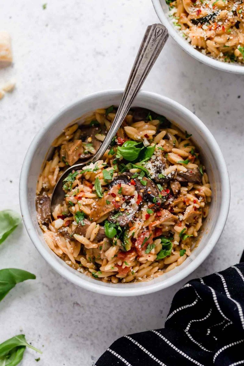 This one-pot creamy orzo with chicken sausage is a delightful dish that can be thrown together even on the busiest of weeknights! Use whatever you have in the fridge and you're sure to have a delicious meal at the end!