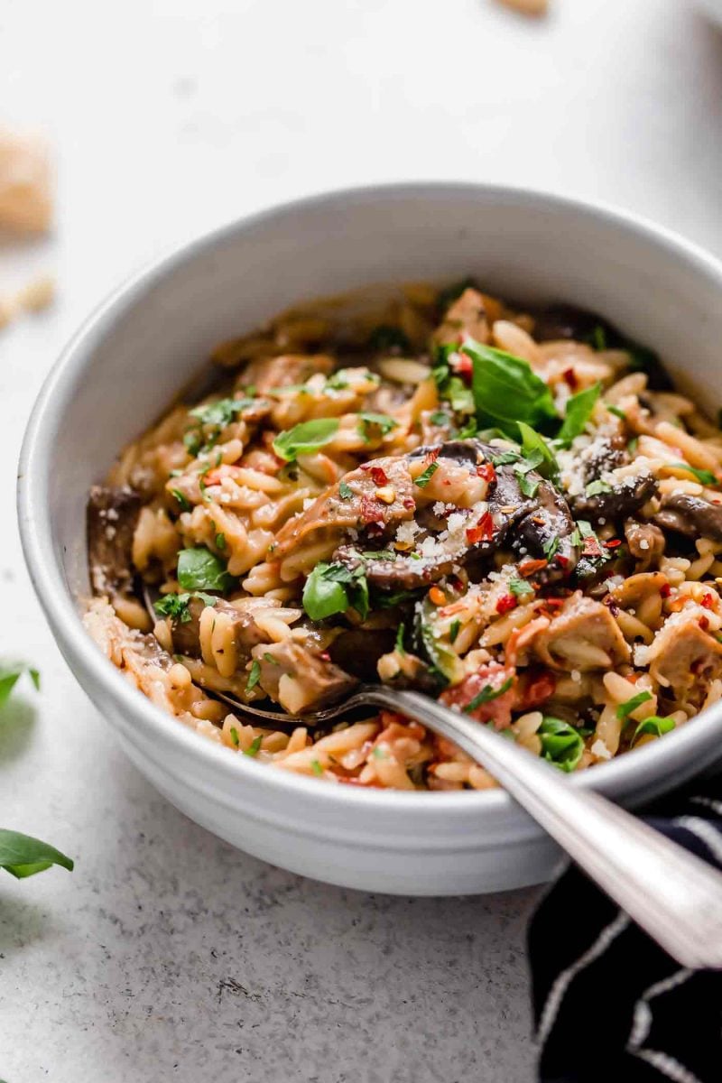 This one-pot creamy orzo with chicken sausage is a delightful dish that can be thrown together even on the busiest of weeknights! Use whatever you have in the fridge and you're sure to have a delicious meal at the end!