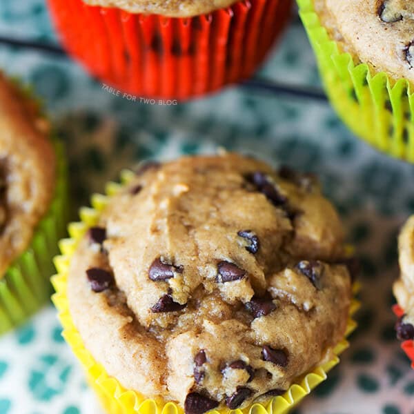 Banana Peanut Butter Chocolate Chip Muffins are the perfect way to use up extra bananas! Recipe on tablefortwoblog.com