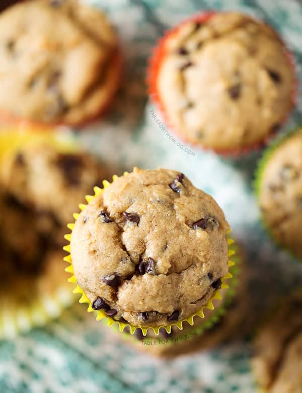 Banana Peanut Butter Chocolate Chip Muffins are the perfect way to use up extra bananas! Recipe on tablefortwoblog.com