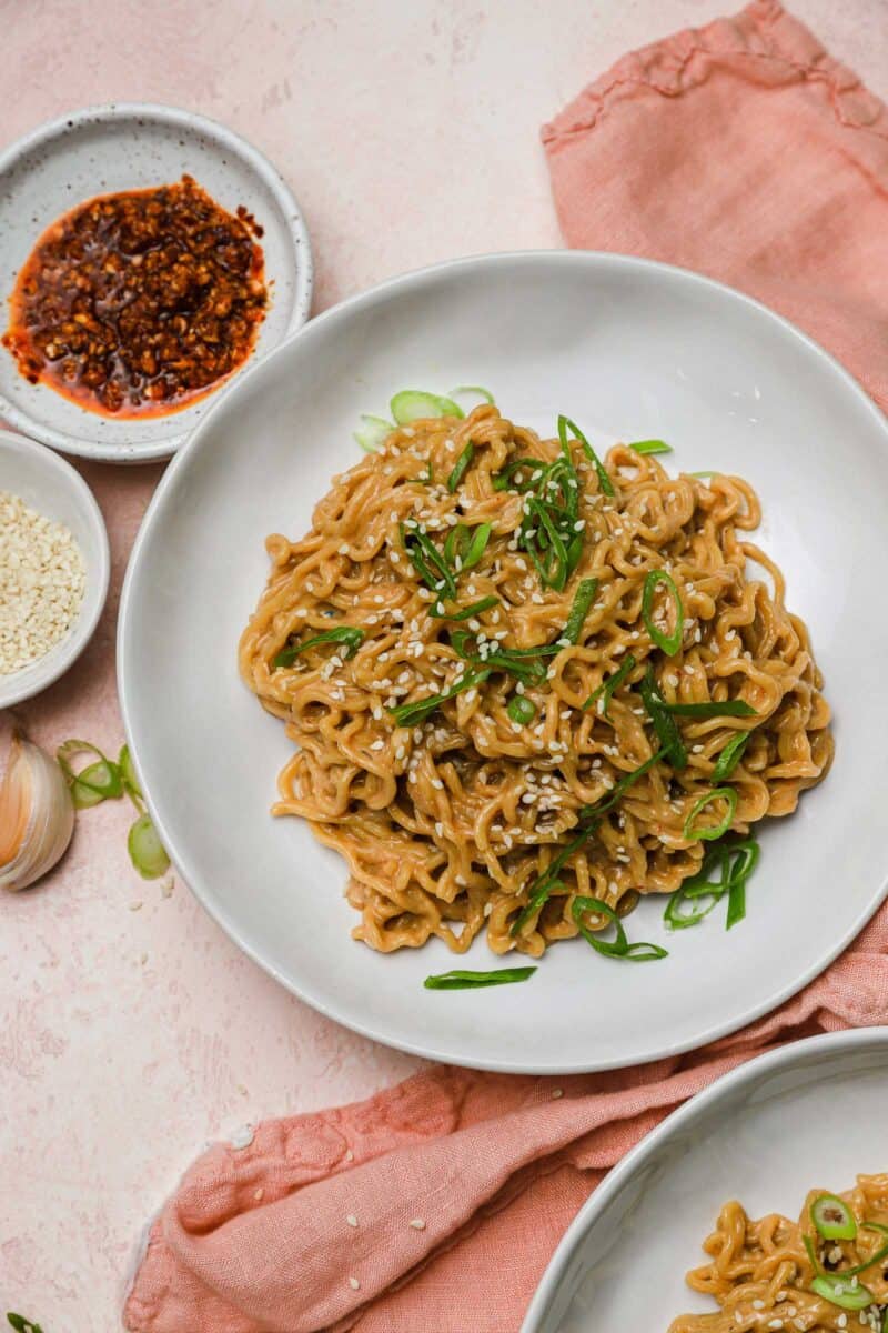 These cold spicy peanut sesame noodles are nostalgic because it reminds me of childhood and my mother's intricate school lunches. Spicy peanut sesame noodles are served cold so they're incredibly refreshing on a warm day!