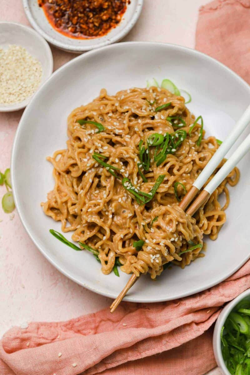 These cold spicy peanut sesame noodles are nostalgic because it reminds me of childhood and my mother's intricate school lunches. Spicy peanut sesame noodles are served cold so they're incredibly refreshing on a warm day!