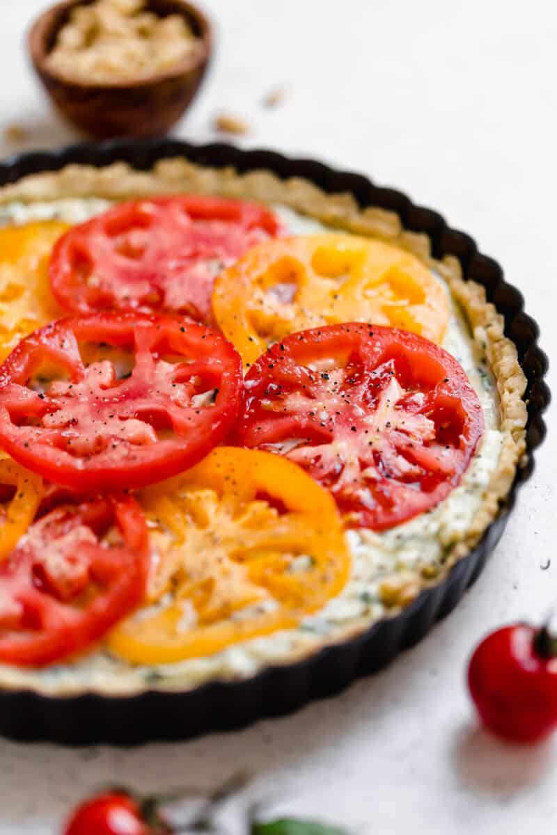 This gorgeous tomato ricotta tart uses up all your summer's freshest tomatoes! Just another way to eat up all of summer!