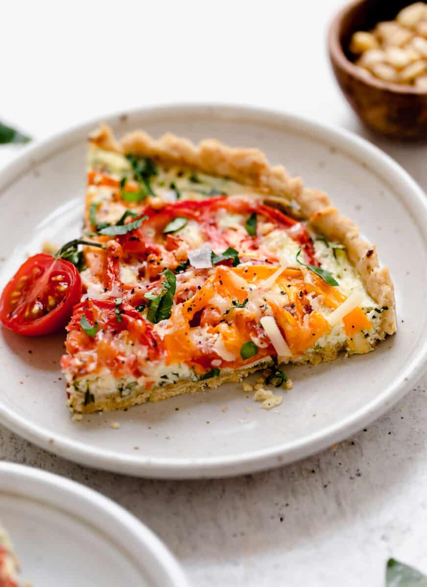 This gorgeous tomato ricotta tart uses up all your summer's freshest tomatoes! Just another way to eat up all of summer!