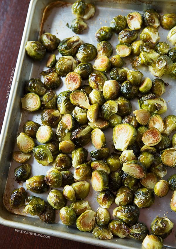 One of the best ways to eat brussels sprouts is to roast them with some garlic! Recipe on tablefortwoblog.com