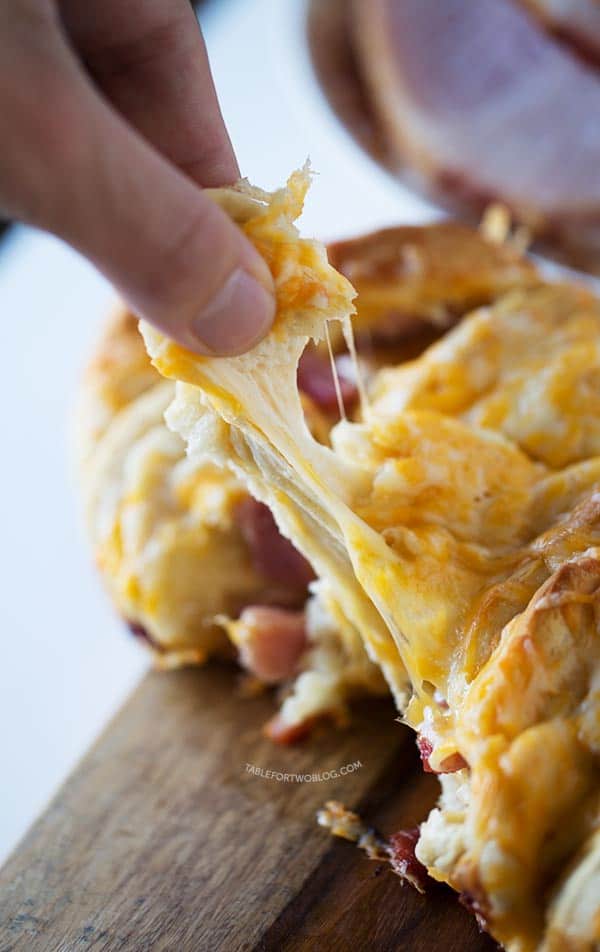 Ham and cheese pull apart bread is so easy to make for a crowd! Recipe on tablefortwoblog.com