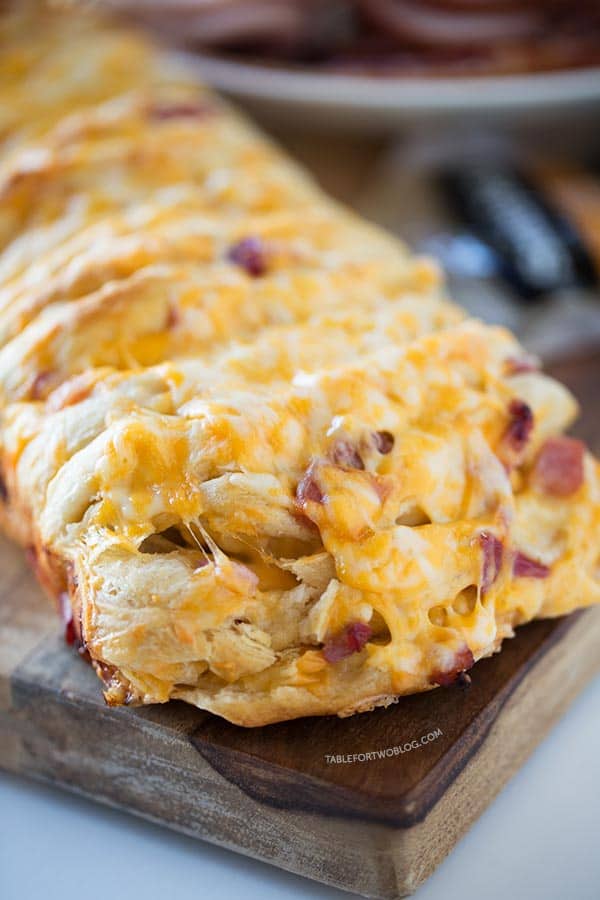Ham and cheese pull apart bread is so easy to make for a crowd! Recipe on tablefortwoblog.com