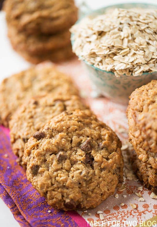 The chewiest and slightly crisp honey oatmeal chocolate chip cookies! Recipe on tablefortwoblog.com