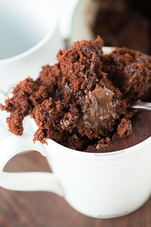 The moistest chocolate mug cake you will ever have! It's not spongy like other mug cakes! Recipe on tablefortwoblog.com