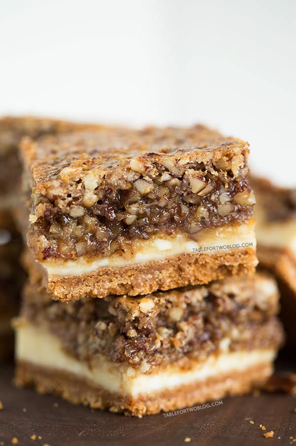 Hazelnut pecan cheesecake bars is a decadent treat perfect for sharing! Recipe on tablefortwoblog.com