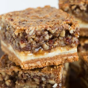 Hazelnut pecan cheesecake bars is a decadent treat perfect for sharing! Recipe on tablefortwoblog.com