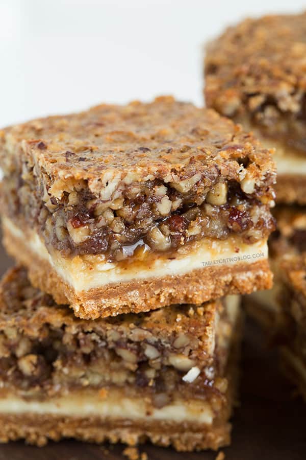 Hazelnut pecan cheesecake bars is a decadent treat perfect for sharing! Recipe on tablefortwoblog.com