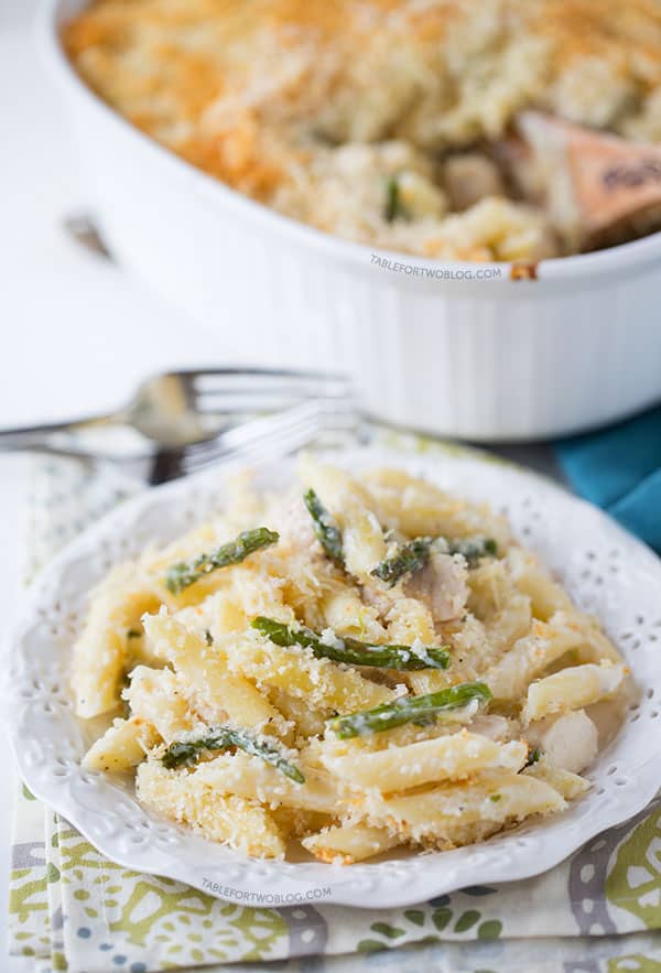 Roasted asparagus and chicken penne bake is a great way to use up the in-season asparagus! Recipe on tablefortwoblog.com