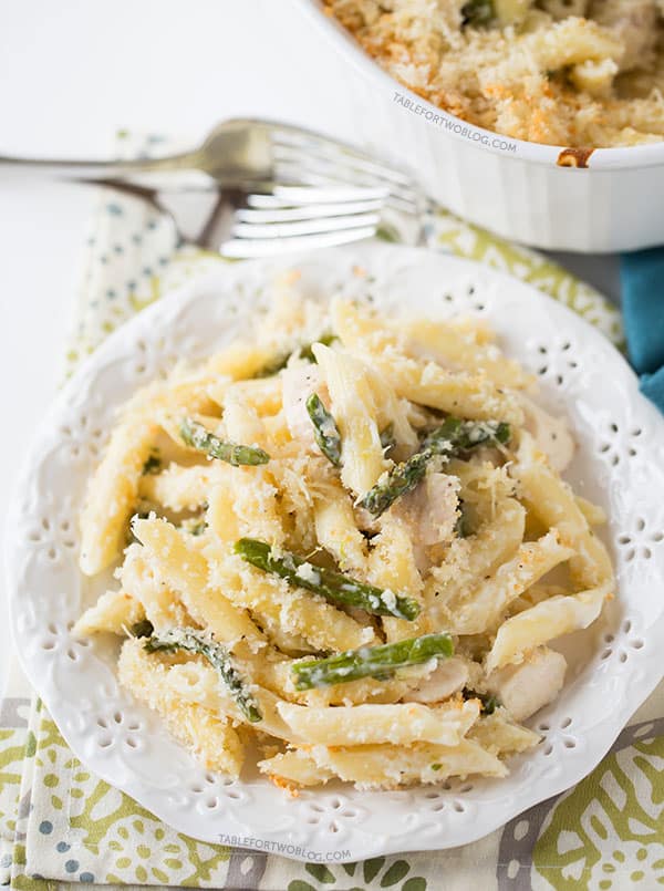 Roasted asparagus and chicken penne bake is a great way to use up the in-season asparagus! Recipe on tablefortwoblog.com