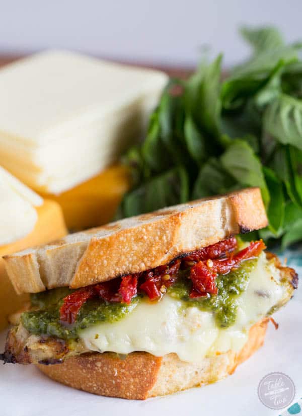 Turn on the grill & whip up this cheesy pesto chicken sandwich made with LAND O LAKES® Sharp Cheddar American Blend!
