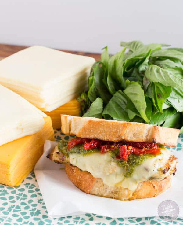 Turn on the grill & whip up this cheesy pesto chicken sandwich made with LAND O LAKES® Sharp Cheddar American Blend!