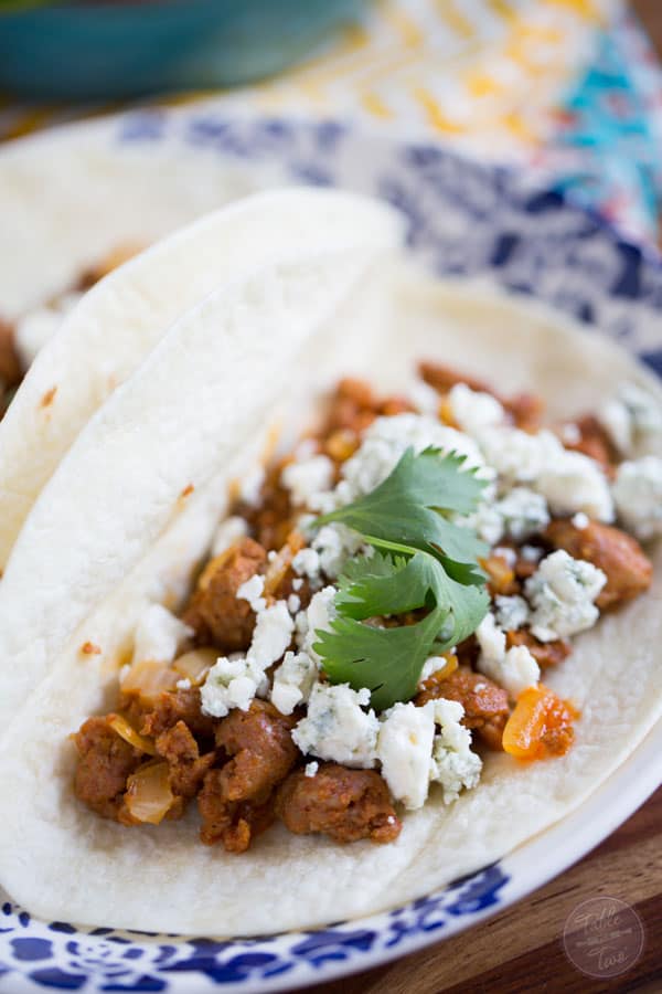 If you've never had blue cheese on tacos, you're missing out! It pairs perfectly with the spicy chorizo!