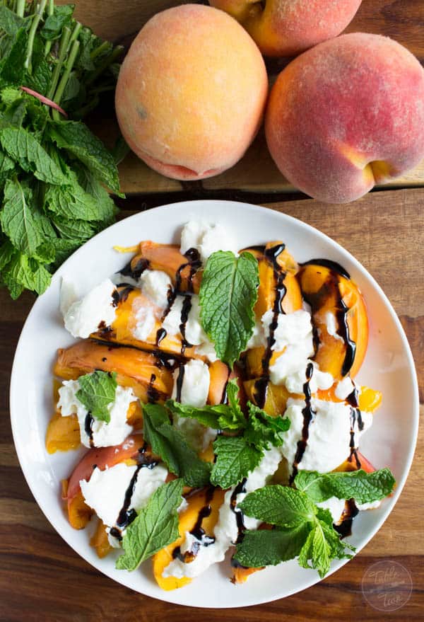 Grilled peaches with burrata, mint, and balsamic drizzle is a super easy summer appetizer that you'll want to have all summer long!