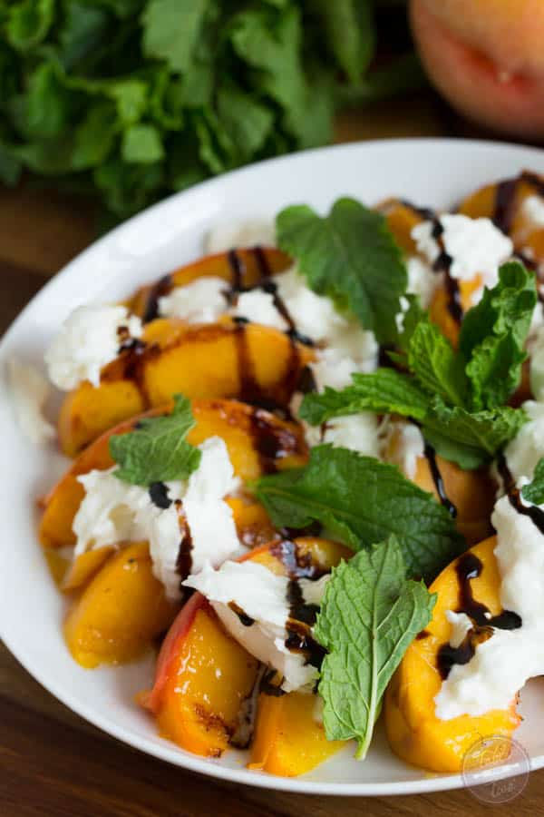 Grilled peaches with burrata, mint, and balsamic drizzle is a super easy summer appetizer that you'll want to have all summer long!