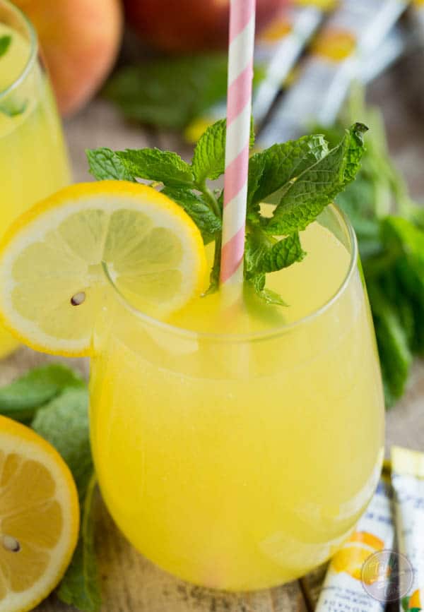 Sparkling Mint Peach Lemonade is refreshing, sweet, and full of bubbles! You'll want a large pitcher of this!