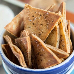 Homemade seasoned pita chips are so easy to make and perfect to pair with your favorite dip and favorite game on TV!