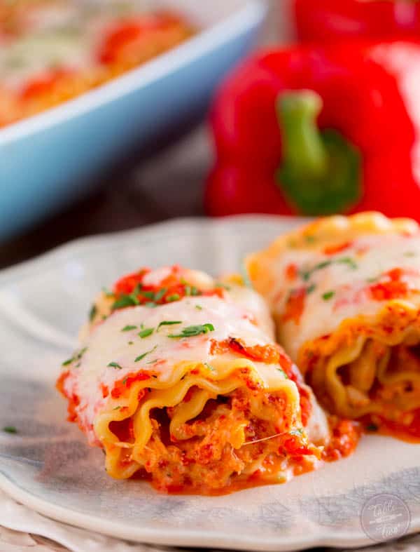 Roasted red pepper chicken lasagna rolls are a flavorful and fun twist on the classic way lasagna! Give these rolls a try!