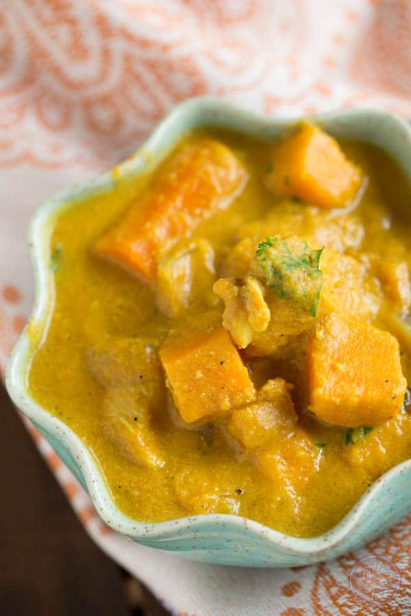 The BEST slow cooker dish you'll have this season! If you love the flavors of Indian cuisine, this is slow cooker pumpkin coconut curry is a KEEPER!