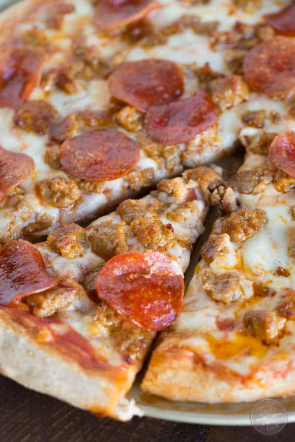 Spicy sausage and pepperoni pizza is so much better made at home than getting delivery! You'll thank me later!