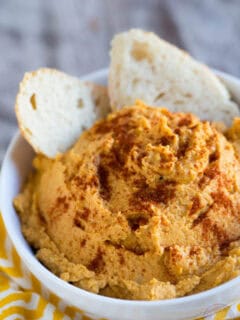 Spiced pumpkin hummus is a great seasonal dip for snack time! A great alternative to the classic hummus!