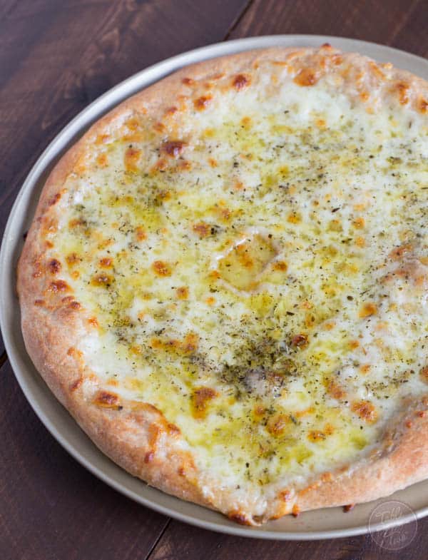 A classic white pizza with a whole-wheat blend crust is the perfect cheesy, oily, and garlic-y pizza for any day of the week!