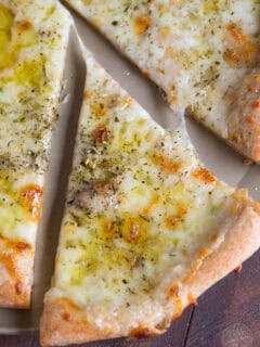 A classic white pizza with a whole-wheat blend crust is the perfect cheesy, oily, and garlic-y pizza for any day of the week!