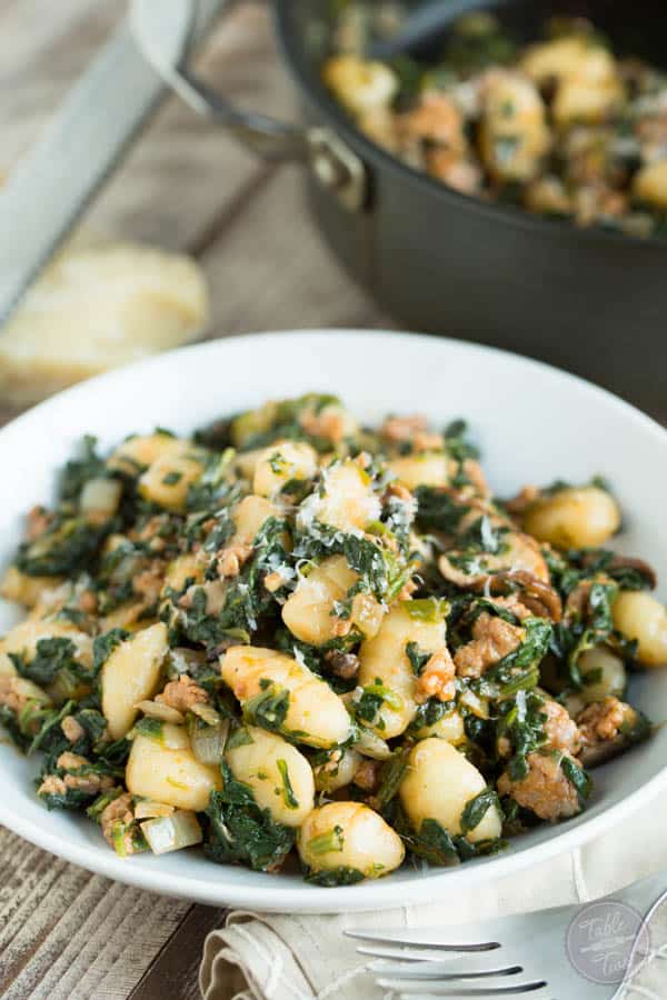 This 15-minute spicy sausage, spinach, and mushroom gnocchi is SO flavorful and incredibly easy to whip up that you'll want it on your dinner table multiple times a week!