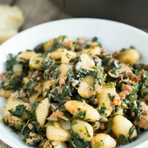 This 15-minute spicy sausage, spinach, and mushroom gnocchi is SO flavorful and incredibly easy to whip up that you'll want it on your dinner table multiple times a week!