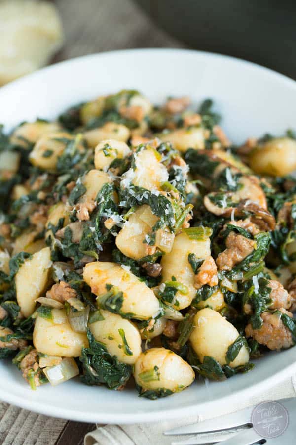 This 15-minute spicy sausage, spinach, and mushroom gnocchi is SO flavorful and incredibly easy to whip up that you'll want it on your dinner table multiple times a week!