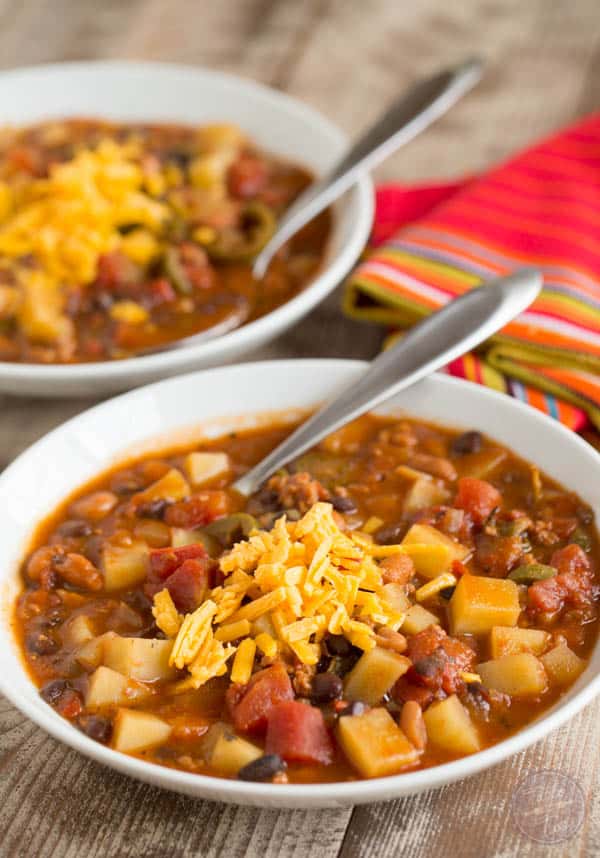 This slow cooker chorizo, potato, and two-bean chili is spicy but fits the bill when you want to warm up on a cold night or craving that fire alarm chili!