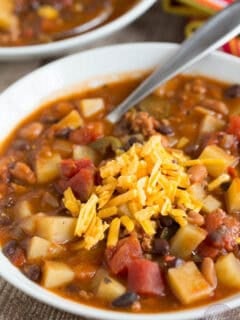This slow cooker chorizo, potato, and two-bean chili is spicy but fits the bill when you want to warm up on a cold night or craving that fire alarm chili!