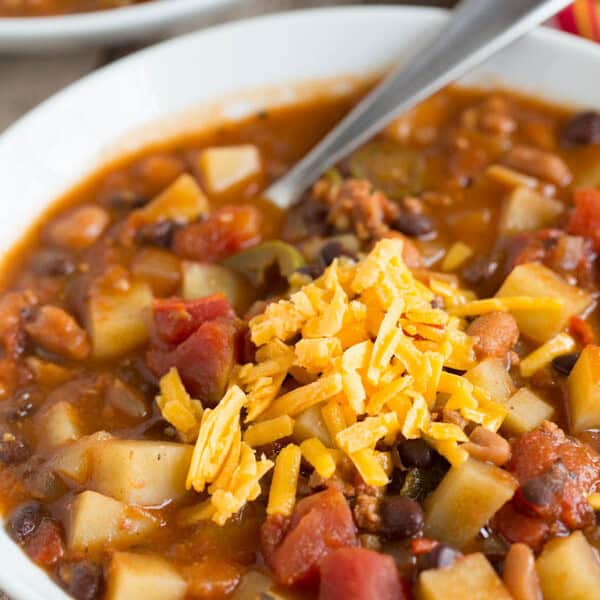 This slow cooker chorizo, potato, and two-bean chili is spicy but fits the bill when you want to warm up on a cold night or craving that fire alarm chili!