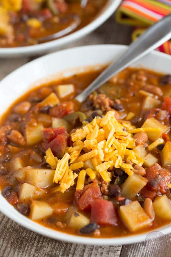 This slow cooker chorizo, potato, and two-bean chili is spicy but fits the bill when you want to warm up on a cold night or craving that fire alarm chili!