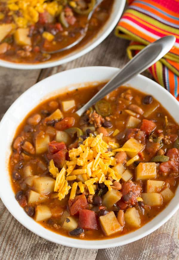 This slow cooker chorizo, potato, and two-bean chili is spicy but fits the bill when you want to warm up on a cold night or craving that fire alarm chili!