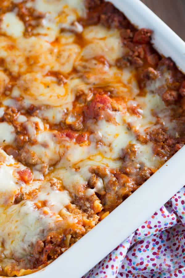 Spicy meaty lasagna is the perfect party casserole! This is a crowd-pleaser! Don't expect to leave with anything left in your casserole dish :)