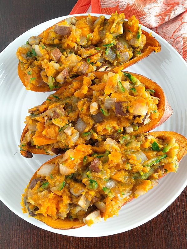 These loaded sweet potatoes are loaded with filling veggies! Shredded zucchini, mushrooms, and onions give this dish huge flavor and will fill you right up!